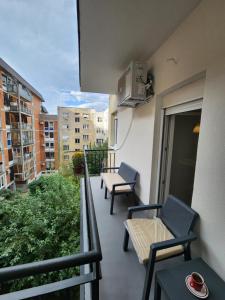 a balcony with two chairs and a table on a building at Modern Cozy Suite - Vracar in Vračar (historical)