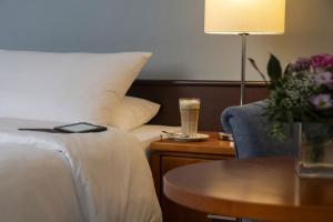 Postel nebo postele na pokoji v ubytování Maritim Hotel Darmstadt
