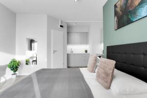 Postel nebo postele na pokoji v ubytování Cozy Studio in Reykjavik