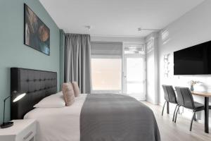 Postel nebo postele na pokoji v ubytování Cozy Studio in Reykjavik