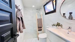 a bathroom with a sink and a mirror at Casa Boutique Luxury Yumbo in Playa del Ingles +70 photos