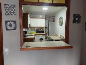 Kuchyň nebo kuchyňský kout v ubytování apartamento gran Vía