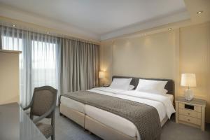 Postel nebo postele na pokoji v ubytování Maritim Hotel Darmstadt