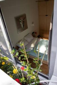 a small room with a bed and a window at Newwww Kolonaki Split Rock KSR1 in Athens