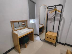 a bathroom with a sink and a mirror at Kartini Stay in Lampung