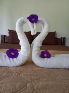 Ένα ή περισσότερα κρεβάτια σε δωμάτιο στο Som PalmGarden