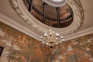 a chandelier hanging from a ceiling in a building at The Capital Hotel, Apartments & Townhouse - Small Luxury Hotels of The World in London