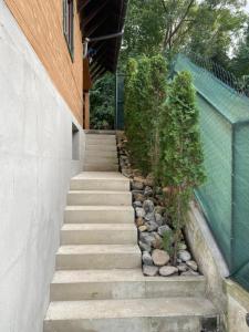 a set of stairs leading up to a building at SKH R - 1 Bedroom in Praid