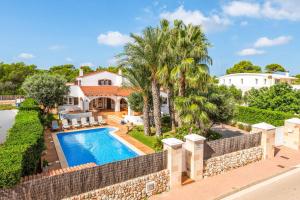 an aerial view of a house with a swimming pool at Villa Juana Blanes in Cala en Blanes