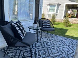 two chairs and a table on a patio at Pet Friendly, 30+ Night Stay in Johnson City