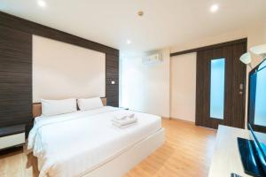 Postel nebo postele na pokoji v ubytování Baycliff Residence Phuket