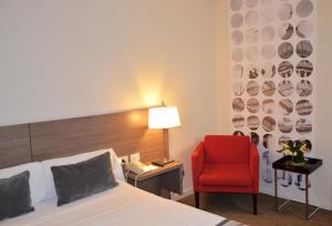 Postel nebo postele na pokoji v ubytování Bisonte Palace Hotel