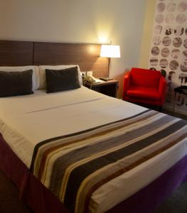 Postel nebo postele na pokoji v ubytování Bisonte Palace Hotel
