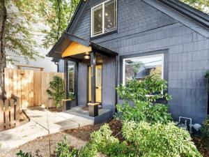 a black house with a black roof at The Auric Door Inn on N Mississippi in Portland