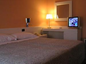 Postel nebo postele na pokoji v ubytování Hotel Giovanni