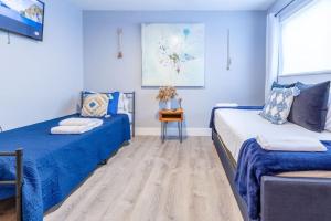 Ένα ή περισσότερα κρεβάτια σε δωμάτιο στο Casa Tropicana - Heated Pool, Game Room & Mins from beach +25 φωτογραφίες