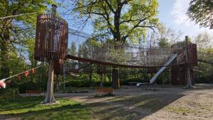 a playground with a slide in a park at Trzy Szczęścia in Zielona Góra