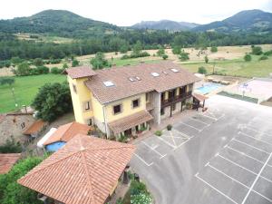 an aerial view of a house with a parking lot at Hotel Intriago I & II in Intriago