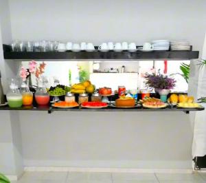 a shelf filled with different types of food at Marcone Lima - Chalés in Barreirinhas +33 photos