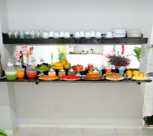 a shelf filled with different types of food at Marcone Lima - Chalés in Barreirinhas