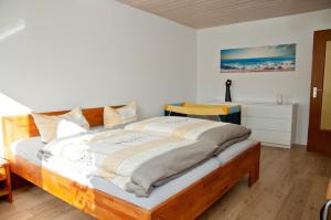 a bedroom with a large bed in a room at Pauloah in Sachsenheim