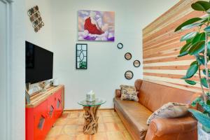 a living room with a couch and a tv at La Colina El Prado Condo with Hot Tub, Deck and Views in El Prado