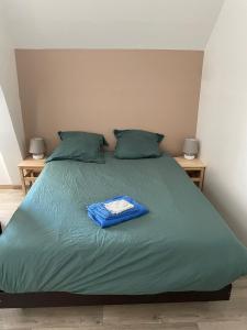 Postel nebo postele na pokoji v ubytování Meublé de tourisme Sejour-La-Roche Pasteur