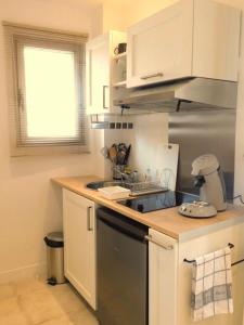 a kitchen with a sink and a stove top oven at #2 Studio # Place charmante in Toulon
