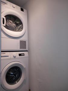 a washing machine and a washer in a room at #2 Studio # Place charmante in Toulon