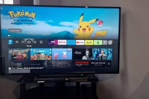 a television screen with a pokémon game on it at 3-Bed Detached House Private Drive for Two Cars in Farsley +38 photos