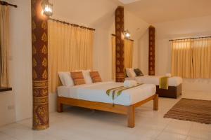 Ліжко або ліжка в номері Baan Tawai Lanna Resort