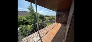 a balcony of a house with a view of a field at aPARTMENT KARL 22 in Alsfeld