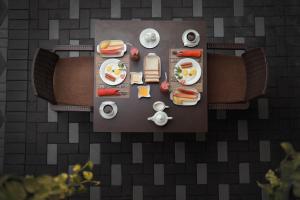 an overhead view of a table with food on it at D Plus B&B Negombo in Negombo