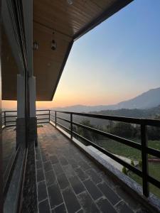 a view from the balcony of a house at The Stone Age : a boutique hotel in Shimla