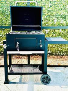 a blue stove sitting on a bench with a laptop at Casa Grandè in Clearwater +46 photos