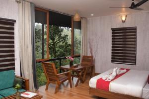 Katil atau katil-katil dalam bilik di TREE6 WAYANAD
