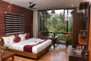 Katil atau katil-katil dalam bilik di TREE6 WAYANAD