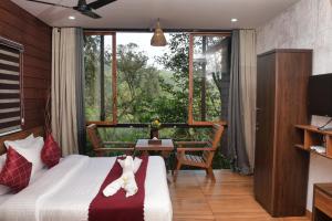 Katil atau katil-katil dalam bilik di TREE6 WAYANAD