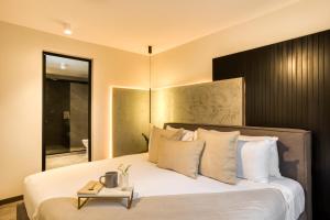 Кровать или кровати в номере ULIV Park Polanco