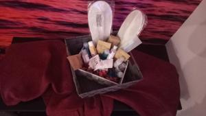 a container of cosmetics sitting on top of a table at Il Paradiso di Marilyn in Milazzo