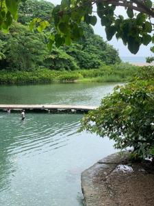 a person in the water in a river at DOÑA CORNELIA in Los Patos