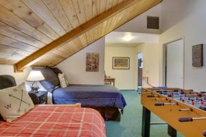 a room with a bed and a table with a chessboard at Dancing Bear Lodge about 1 Mi to Big Bear Lake! in Big Bear Lake