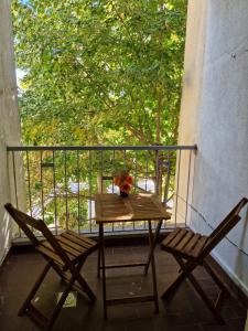 a table and two chairs sitting on a balcony at Apartman Palac in Grude