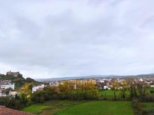 a view of a city from a hill at Casa JRM 'Ribeira Sacra' in Monforte de Lemos +3 photos