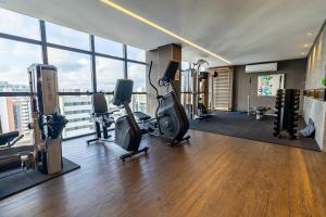 a gym with treadmills and exercise equipment in a building at Edificio Time maior area de lazer de Maceio in Maceió