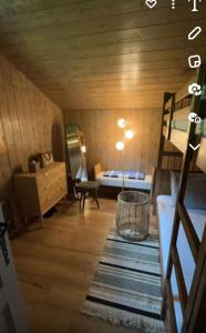 a small room with a bed and a mirror at Chalet luxueux in Châtel