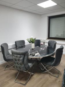 a conference room with a table and chairs at Bataver in Neuss