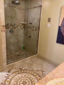 a shower with a glass door in a bathroom at Luxury Bachelor by Halifax Waterfront -Hot Tub in Halifax