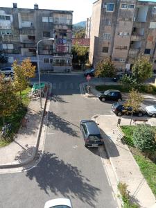 an aerial view of a parking lot with a car at Alvi apartment in Shkodër