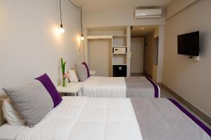 Katil atau katil-katil dalam bilik di M Concept Hotel